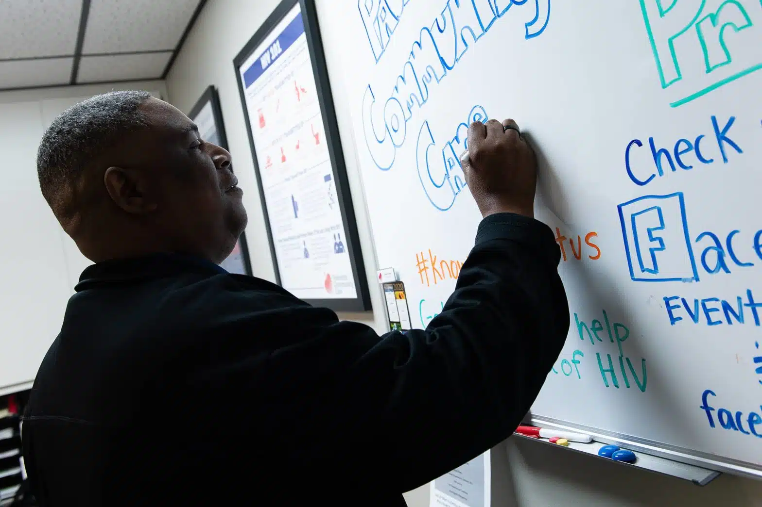 Elmer writing on a white board