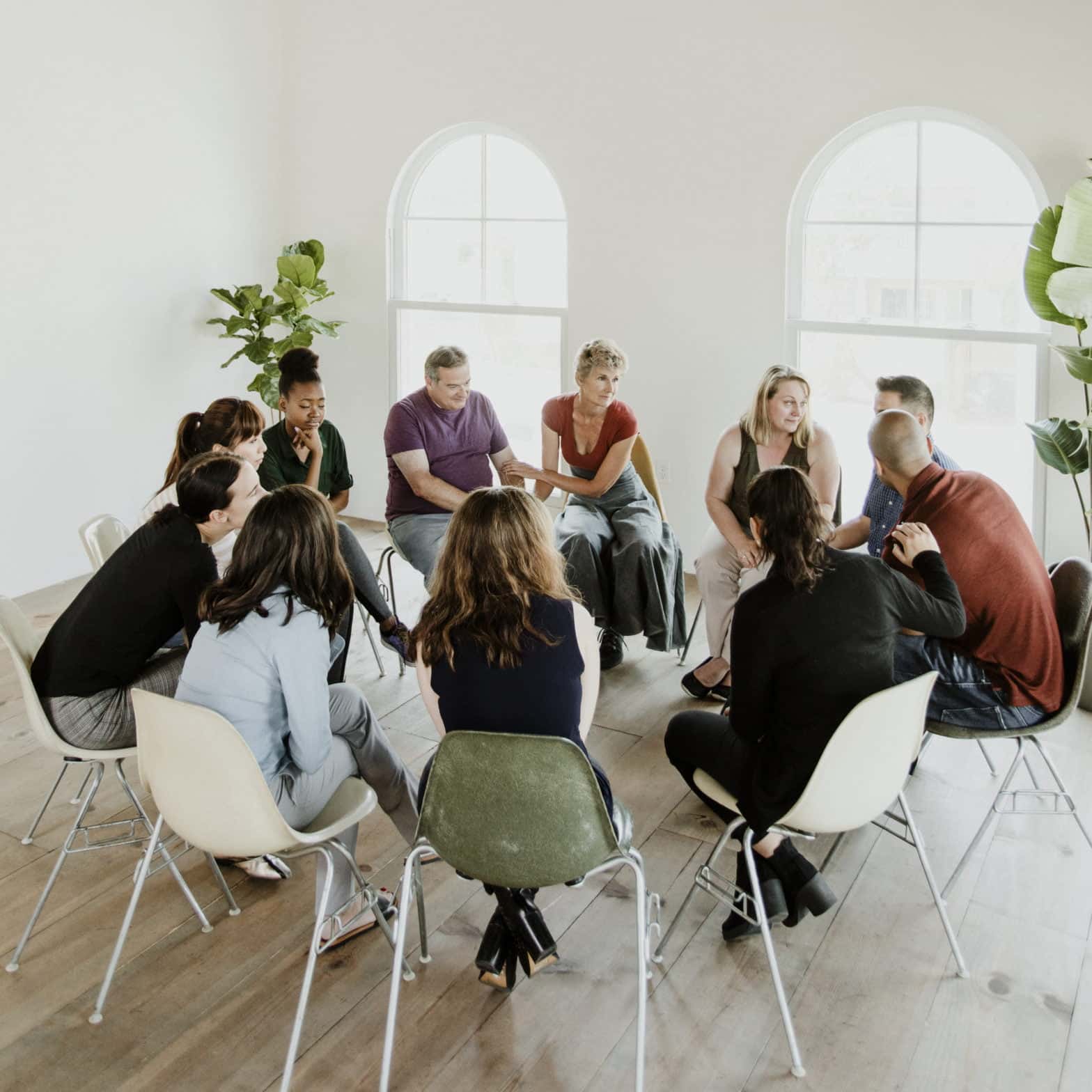 Diverse people in a support group session